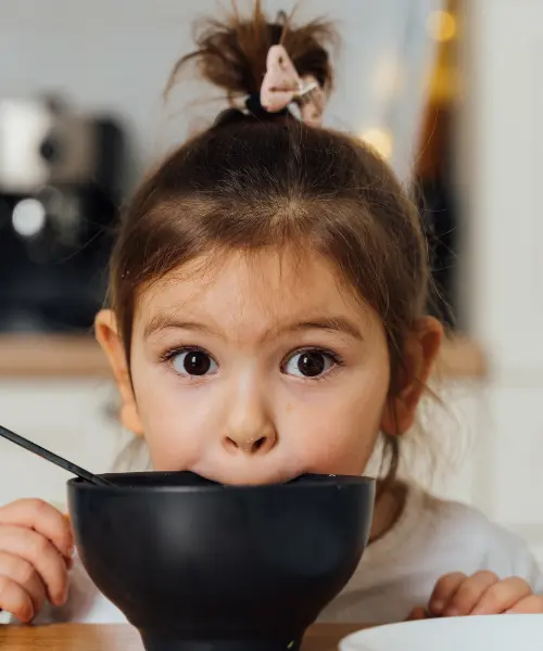 Girl eating at the table
