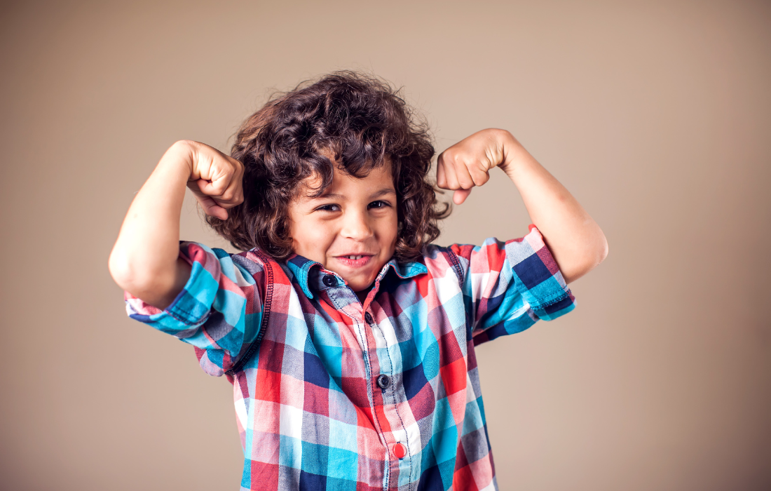 Kid showing of his muscles
