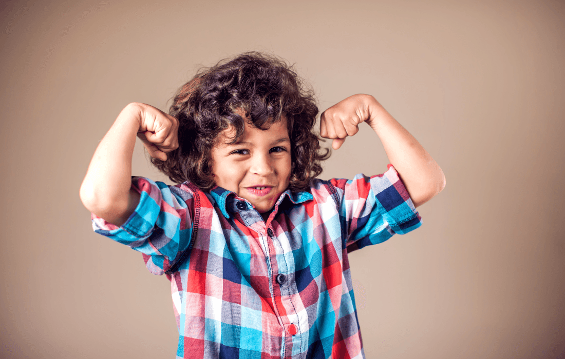 Kid showing of his muscles