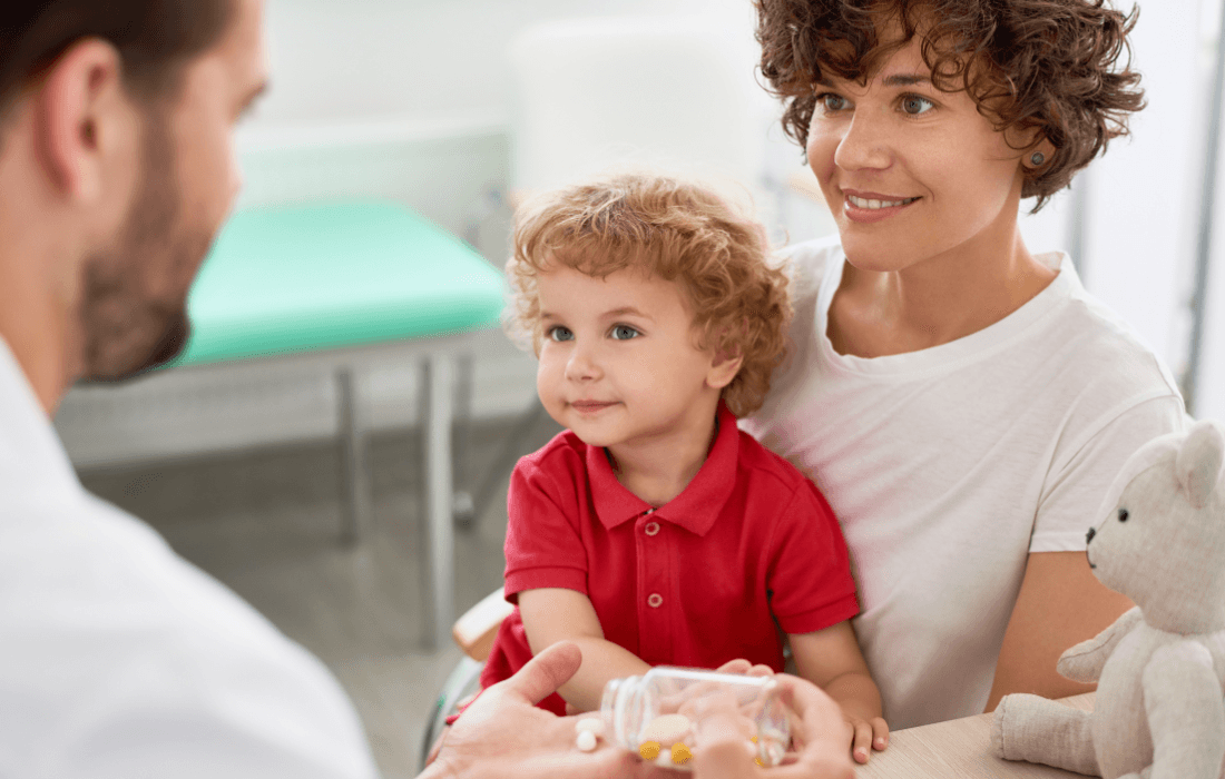 Doctor giving a child a vitamin