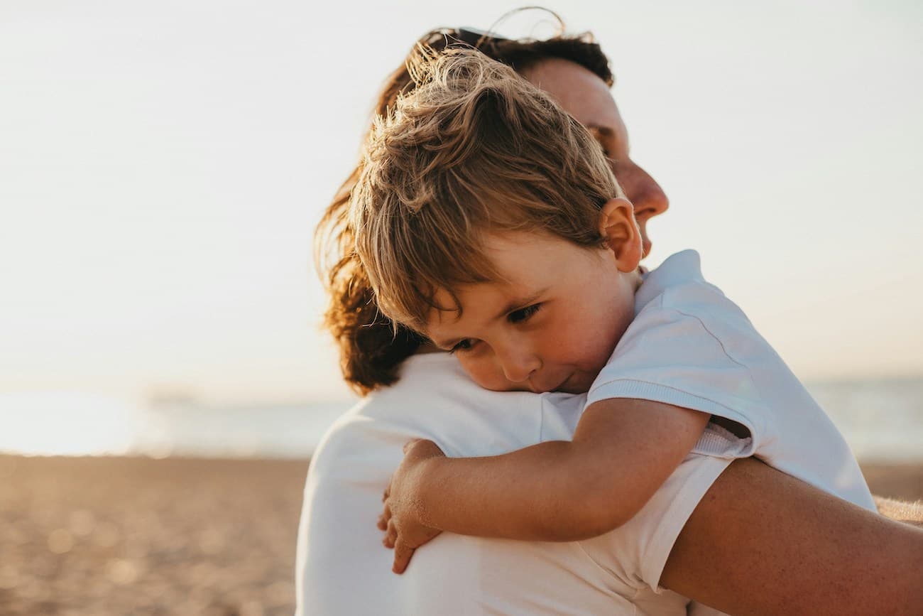 Mom hugging child